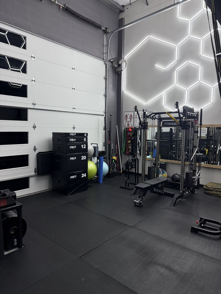 Squat racks under hexagon lighting